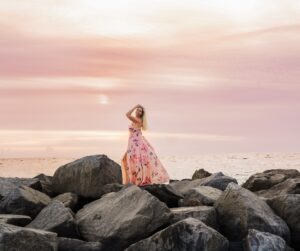 Suzanne O'Brien rocks on beach during sunset